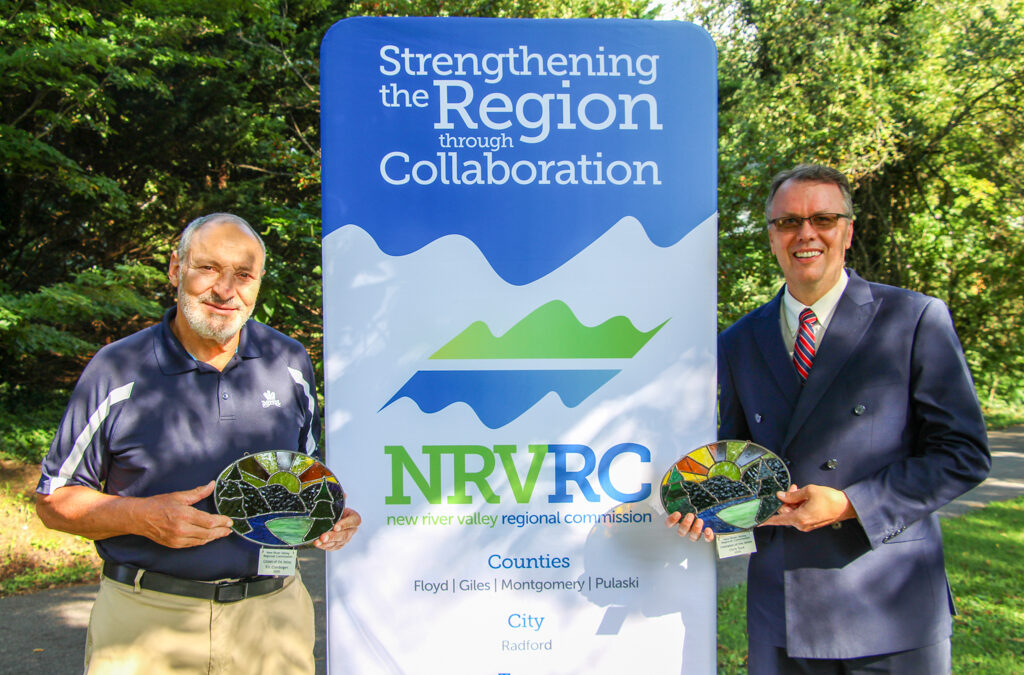 Award winners pose next to NRVRC sign