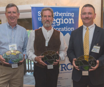 Award winners pose next to NRVRC sign