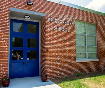 Front door of Price's Fork School with sign